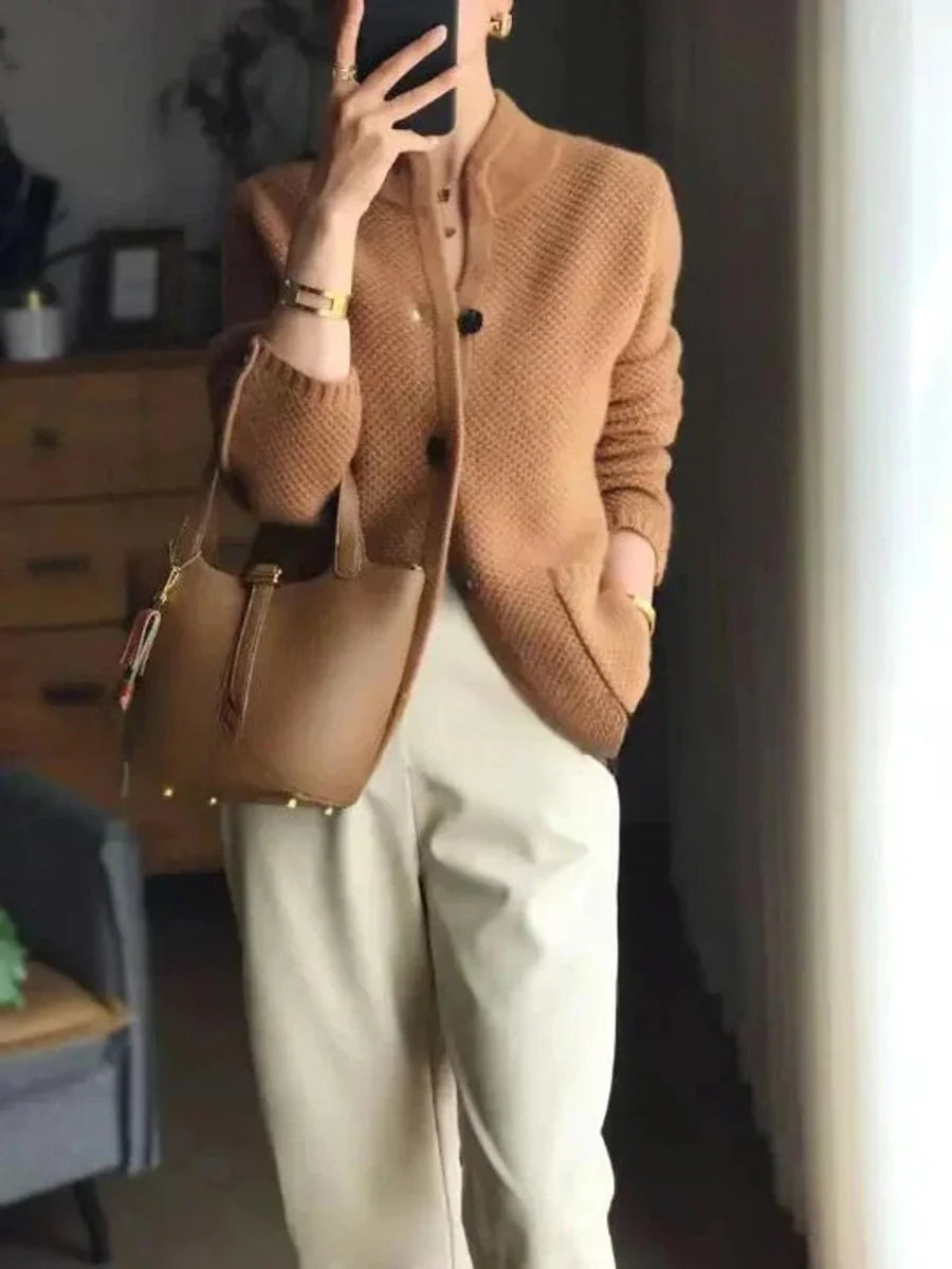 Penelope buttoned wool cardigan worn over a blouse