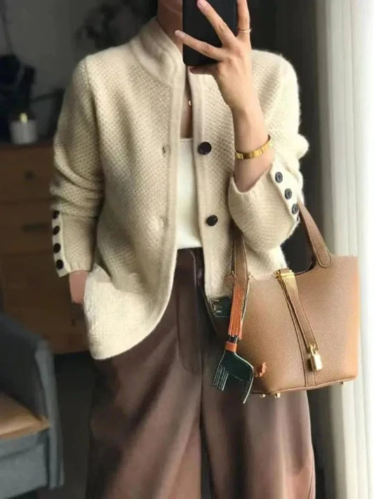 Penelope buttoned wool cardigan worn over a blouse