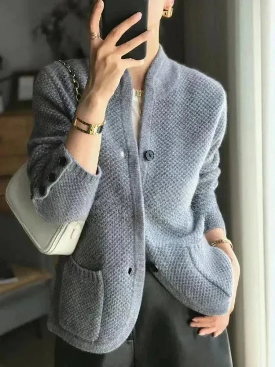 Penelope buttoned wool cardigan worn over a blouse