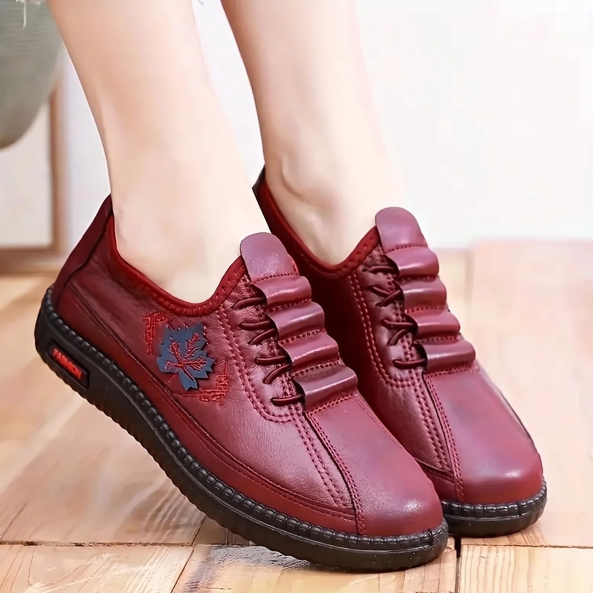 Joanne burgundy leather slip-ons worn on foot